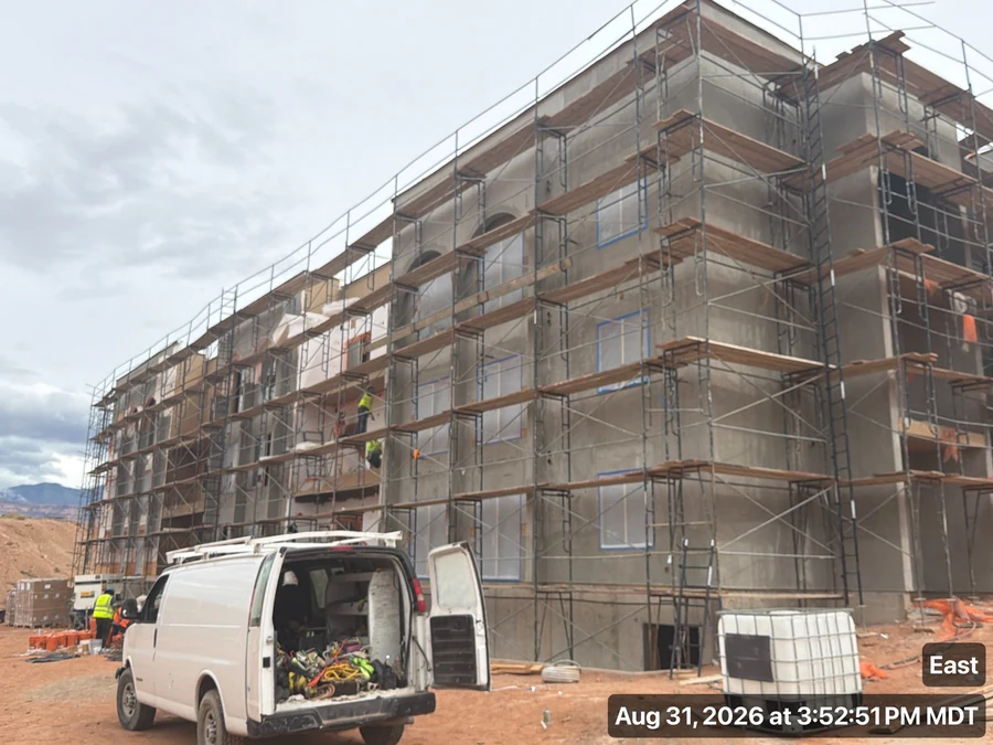 Construction photograph of Building 3 with scaffolding along the exterior walls.